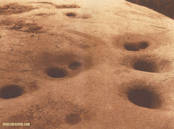 "A boulder milling-stone" - Miwok, by Edward S. Curtis from The North American Indian Volume 14
